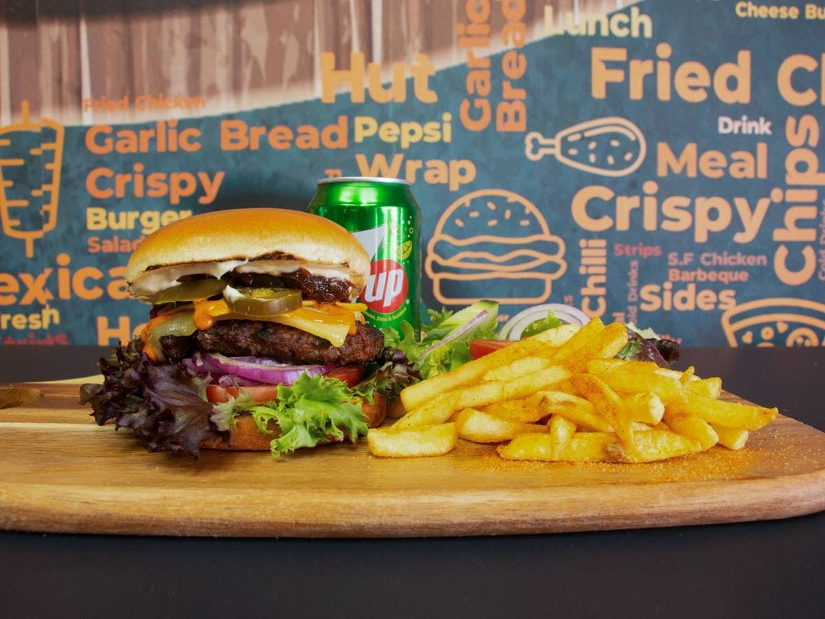 Order Pizza Peppers's gourmet burger now for a crispy and satisfying meal.